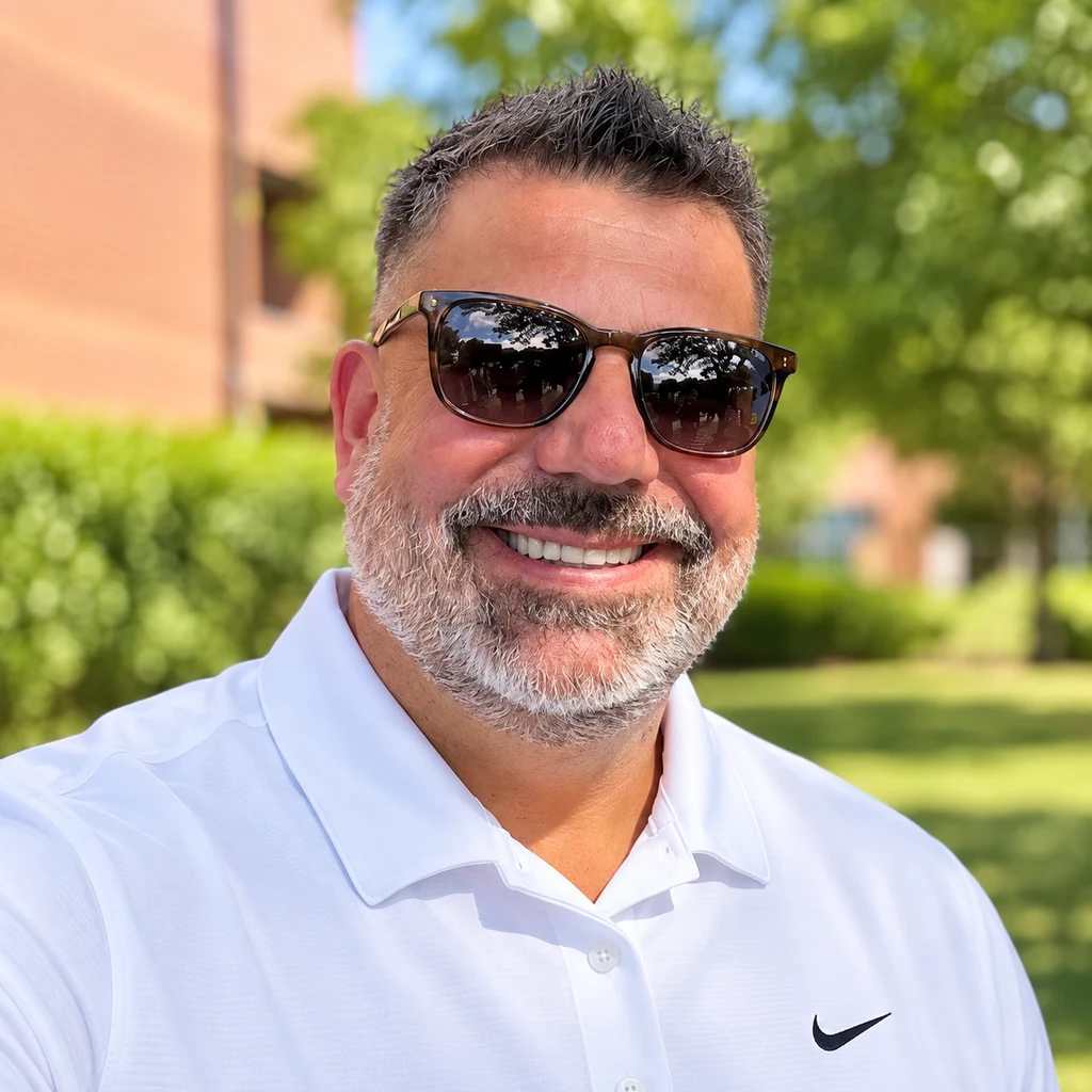 Ken Drazin smiling outdoors